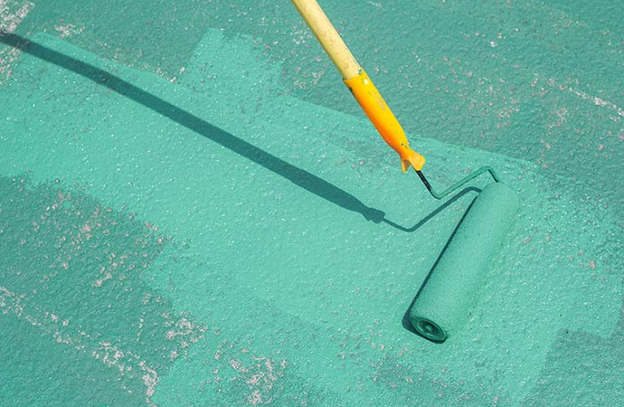 a painter painting a swimming pool