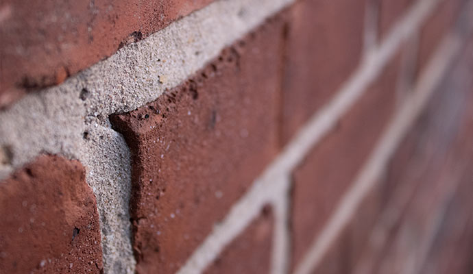 clean reddish brown brick wall with grey morter line 