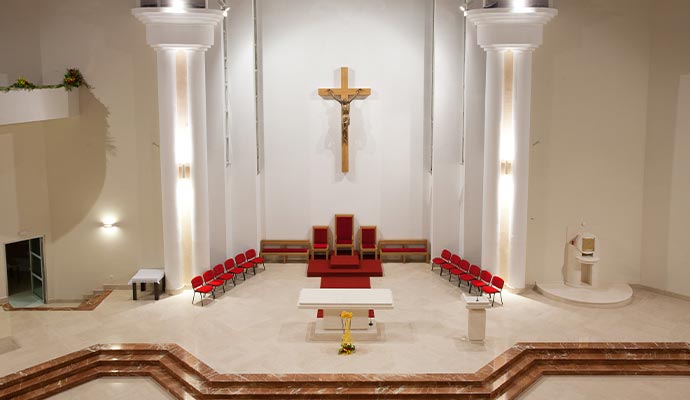 an interior of a modern church with white painted wall